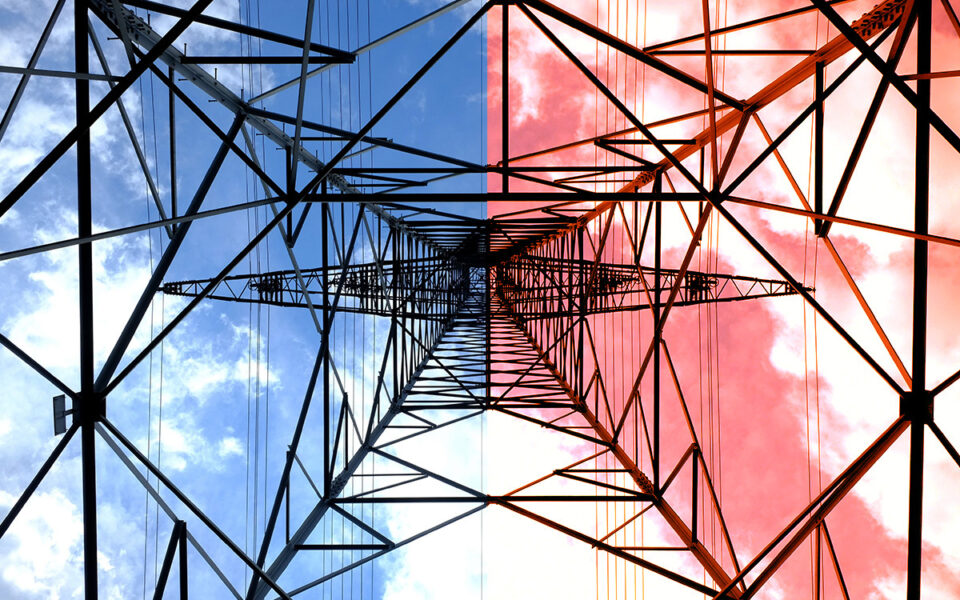 A transmission tower viewed from directly below; the sky above is separated into a blue filter on the left and a red filter on the right