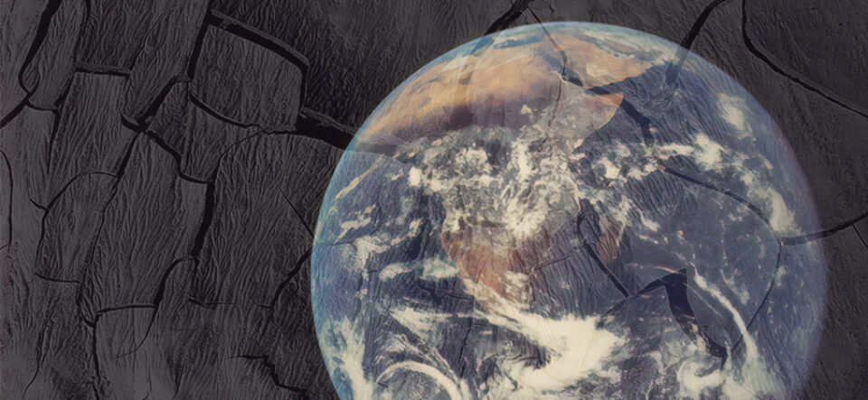 Earth overlayed on black rock