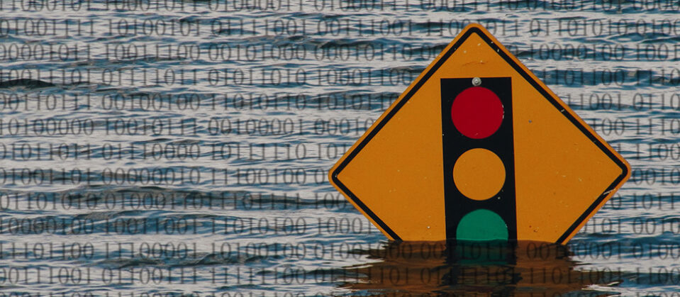 A traffic sign in a flood, transposed with binary code.