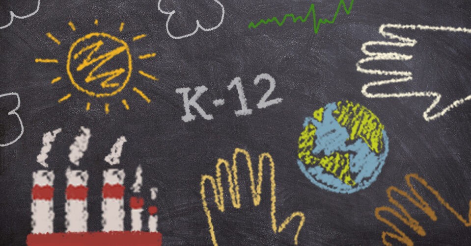 Several images drawn in colored chalk on a black chalkboard: a sun, clouds, the phrase "K-12," smokestacks, a line graph, and handprints surrounding the globe