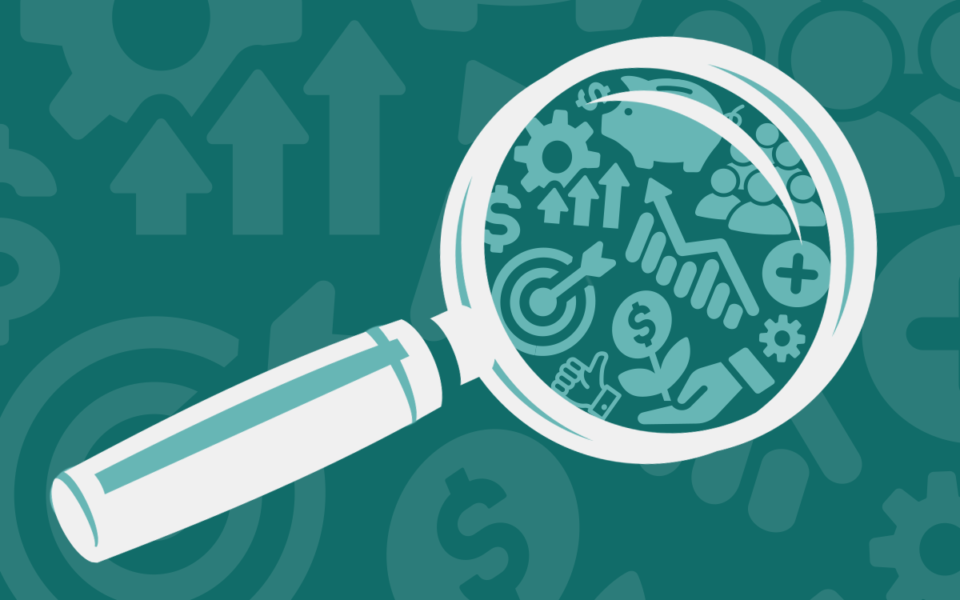 A magnifying glass held over icons symbolizing ESG investing