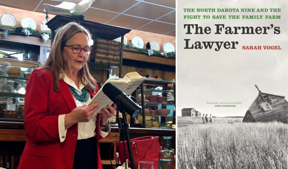 Author Sarah Vogel wearing a read blazer reading from her book The Farmer's Lawyer at a microphone.