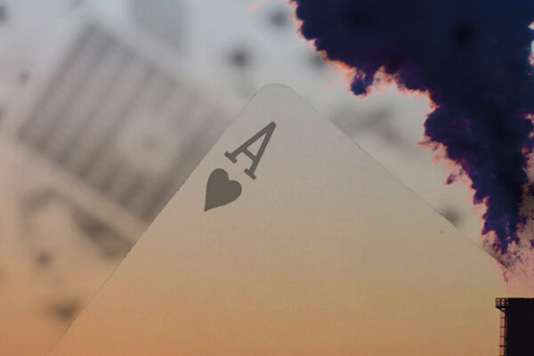 A smoke stack and a hand of cards, showing an Ace of Hearts.