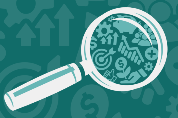 A magnifying glass held over icons symbolizing ESG investing