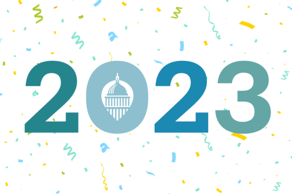 "2023" in large font, with the State Impact Center logo in the middle of the 0; confetti in the background