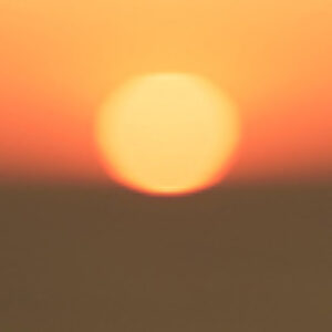 A blurry view of a setting sun