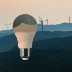 A soft pink, blue, and navy illustration of a lightbulb overlaid on an illustration of wind turbines sprawled out across a hilly landscape
