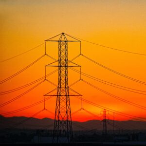 A transmission tower at sunset